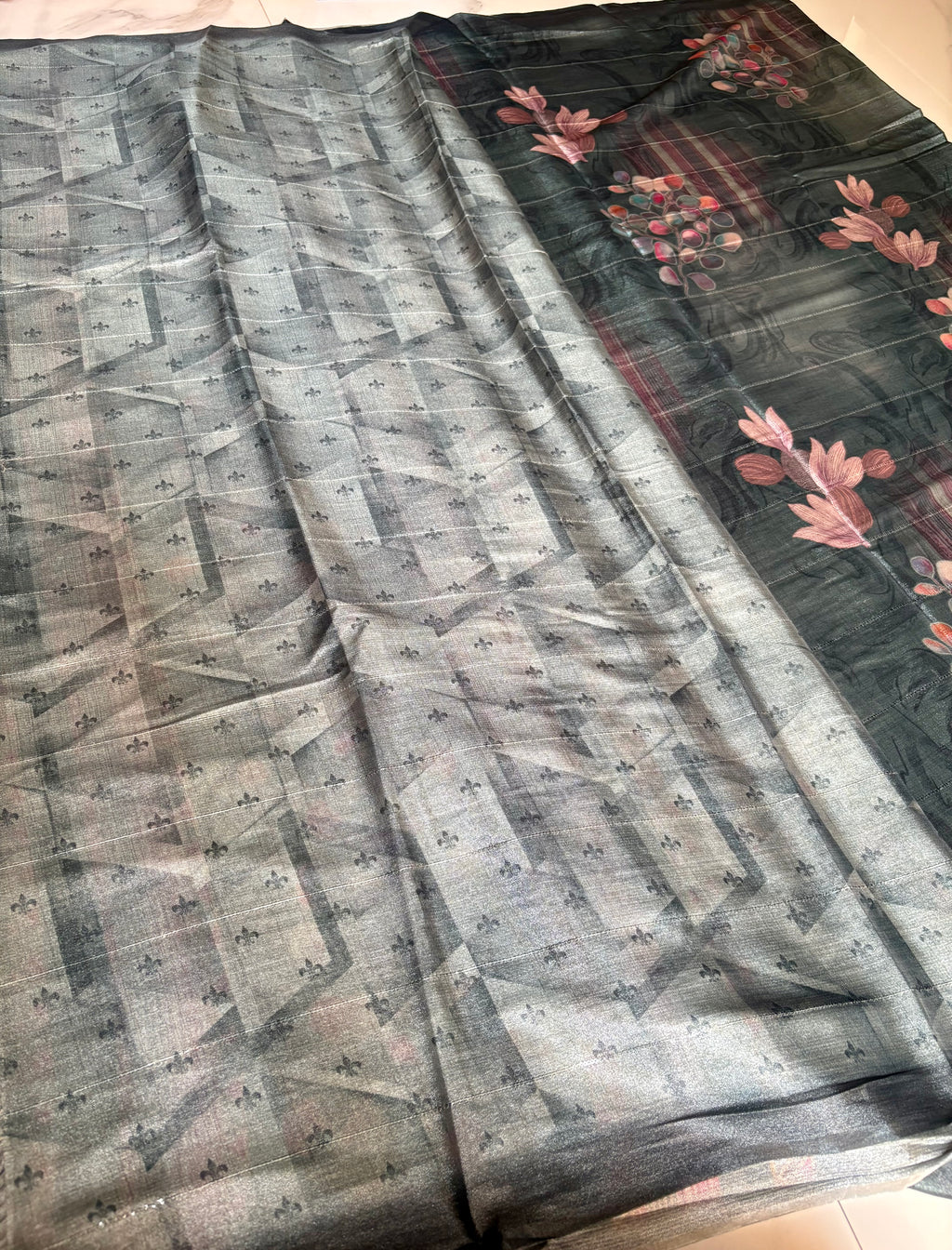 Beautiful charcoal grey Sequinned Silk Blend Soft saree featuring graceful floral digital prints in soft pink and multicolor accents and Tassels.