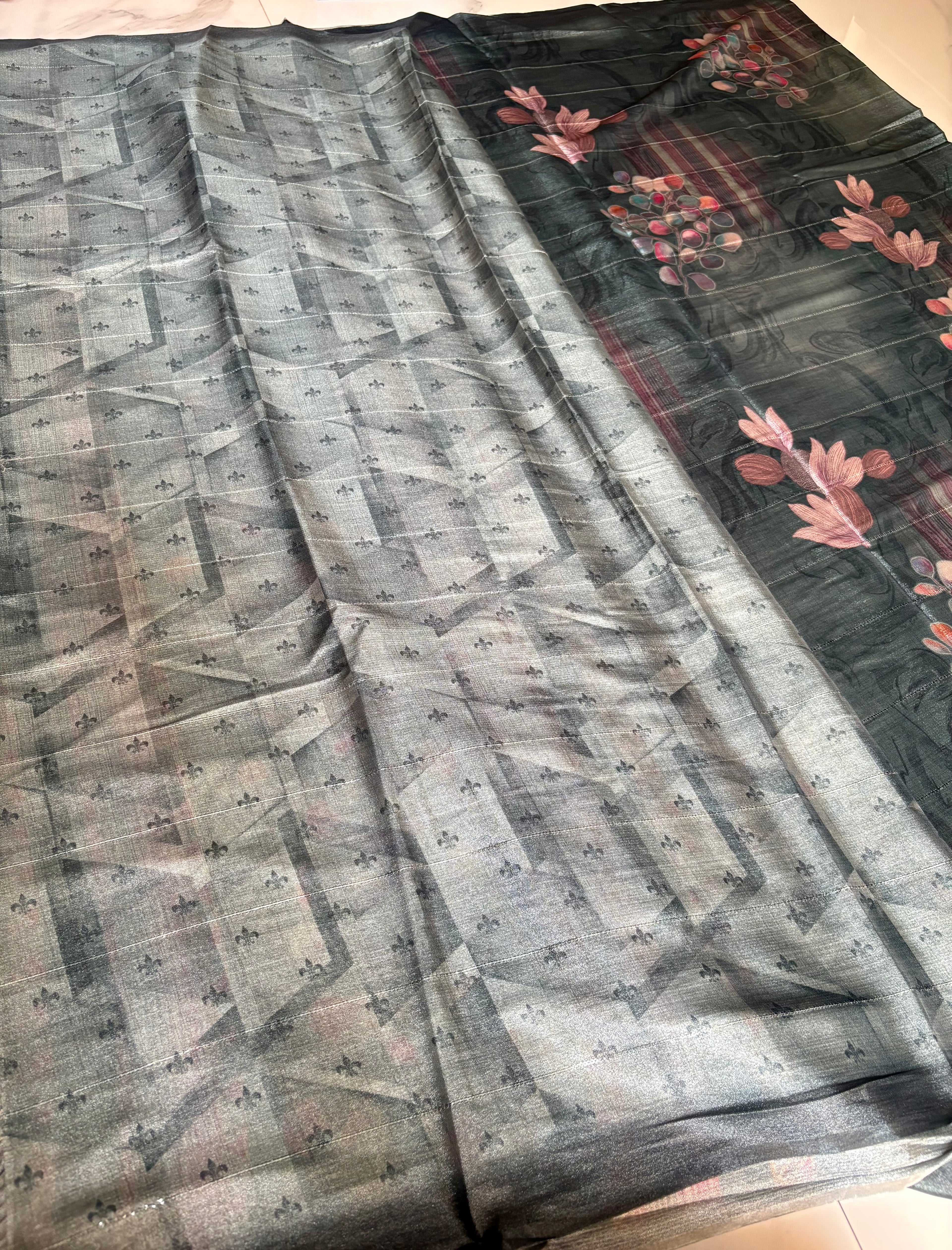 Beautiful charcoal grey Sequinned Silk Blend Soft saree featuring graceful floral digital prints in soft pink and multicolor accents and Tassels.
