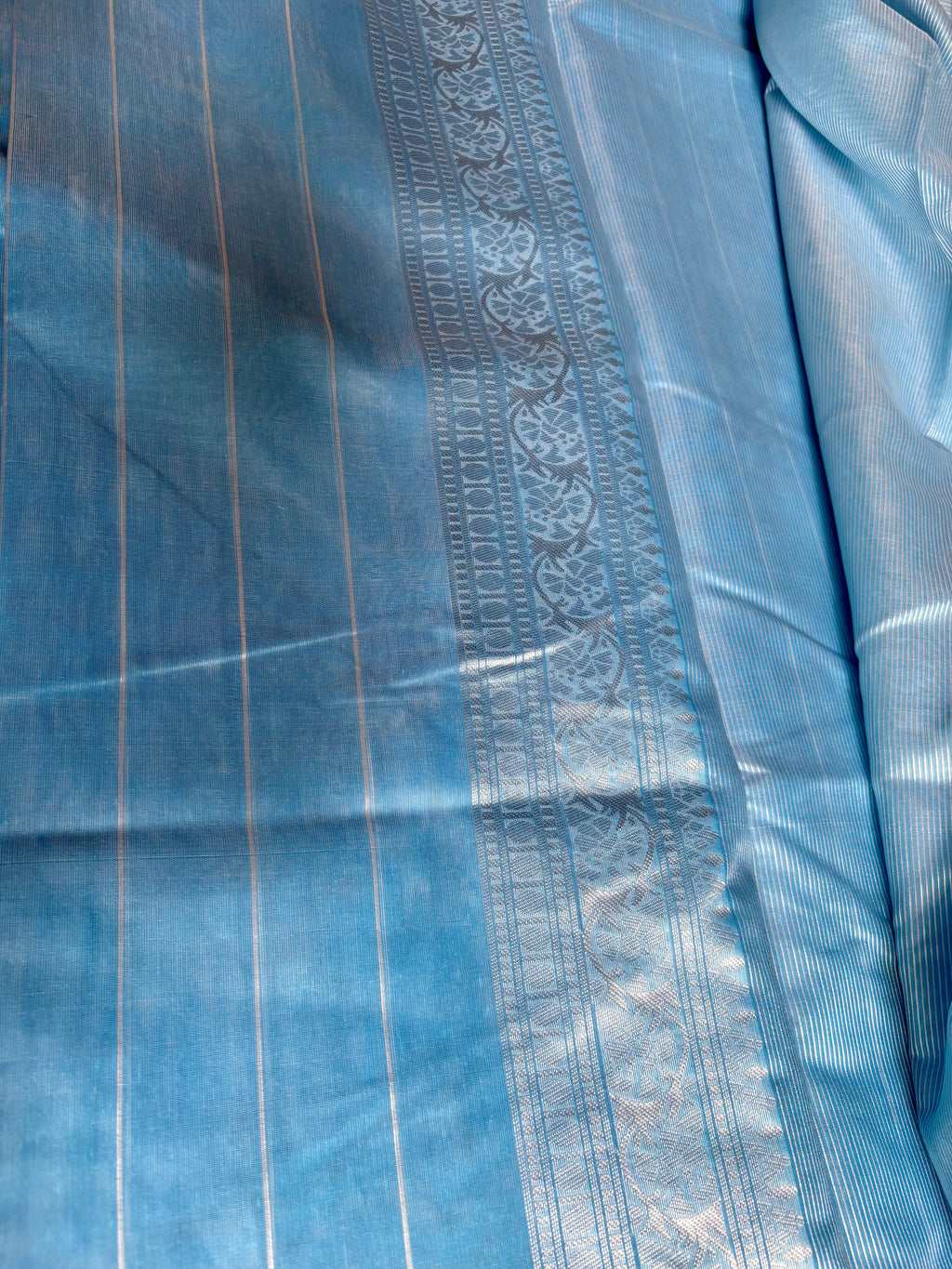 Elegant sky blue Cotton saree featuring intricate silver paisley motifs and delicate detailing with silver border