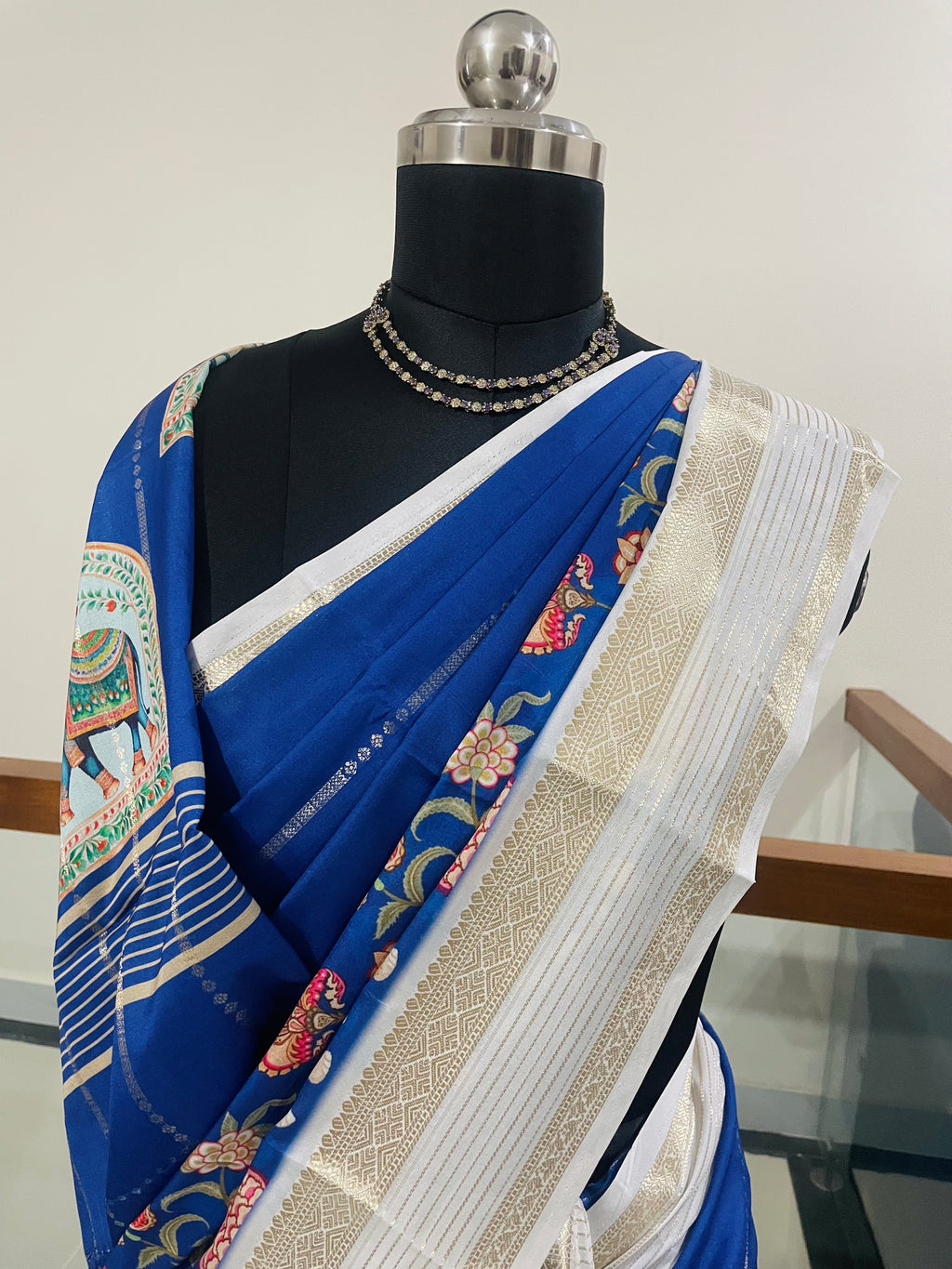 Elegant Royal Blue Yulu Crape semi silk Saree with Elephant artistry Prints with Gold Zari White Border.