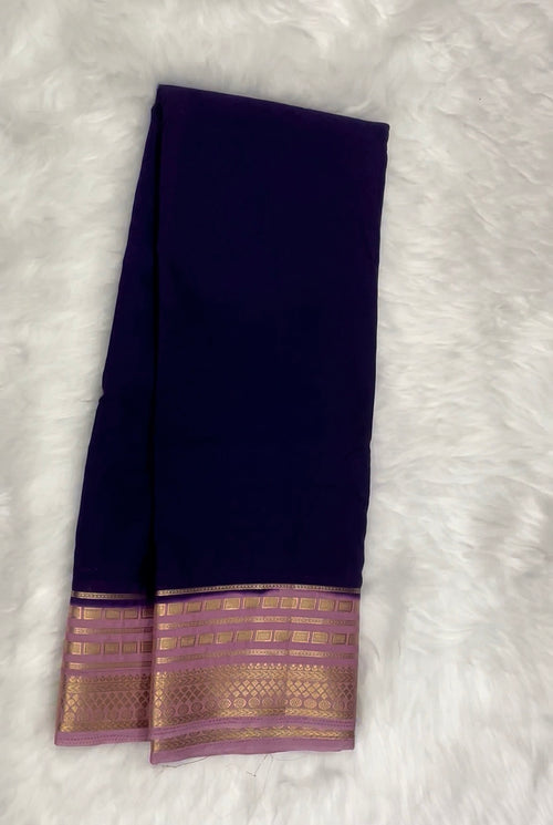 Beautiful Crepe Semi Silk Saree with Striking Combination Of Purple with lavender and gold border, giving it a Regal and Elegant look.