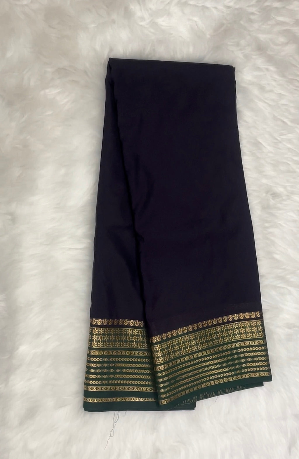 Beautiful Crepe Semi Silk Saree with Striking Combination Of Navy Blue with Green and gold border, giving it a Regal and Elegant look.