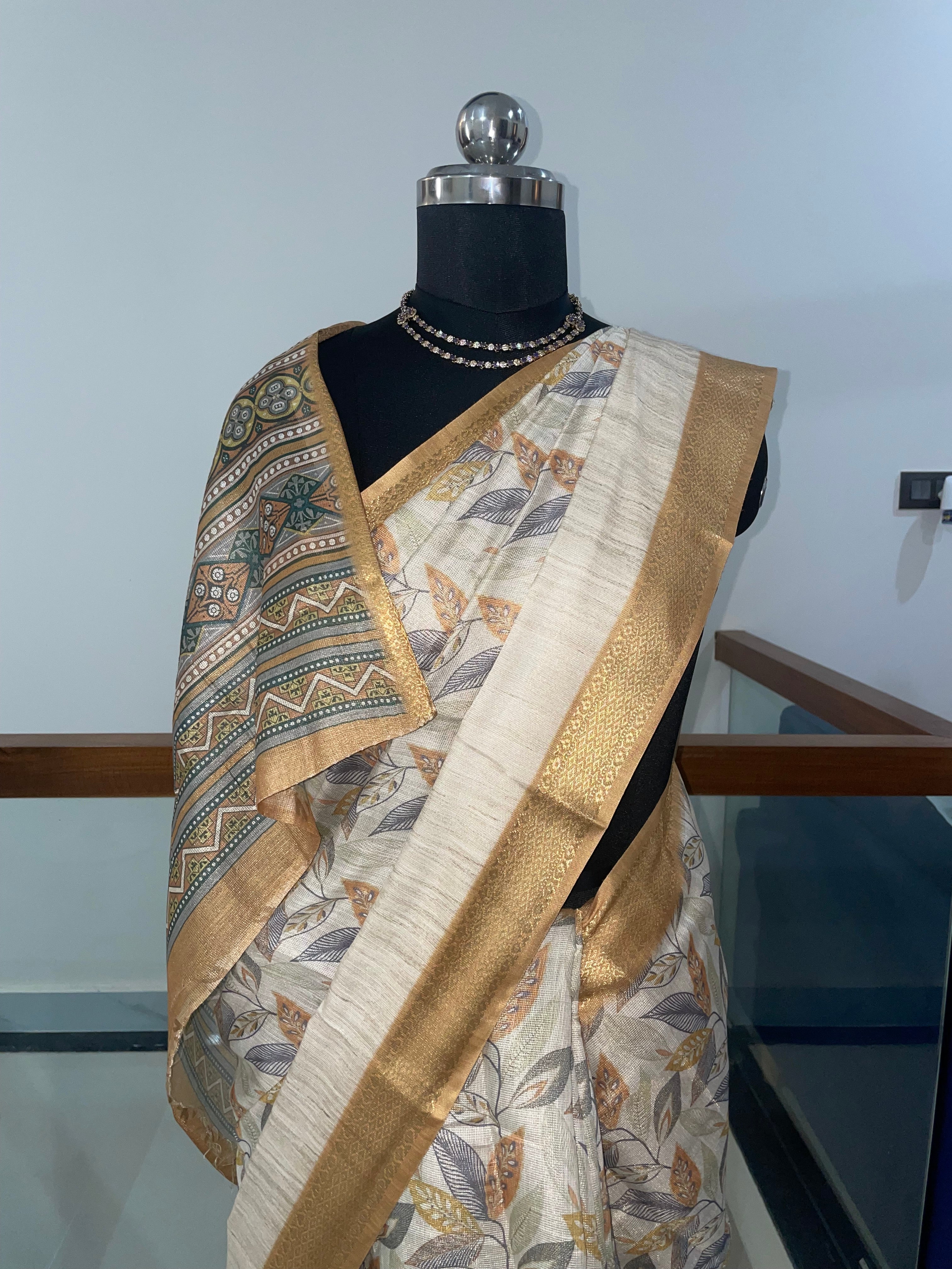 Beautiful Tissue Silk Saree with combination of Cream, Silver and Weaving Gold Zari Saree.