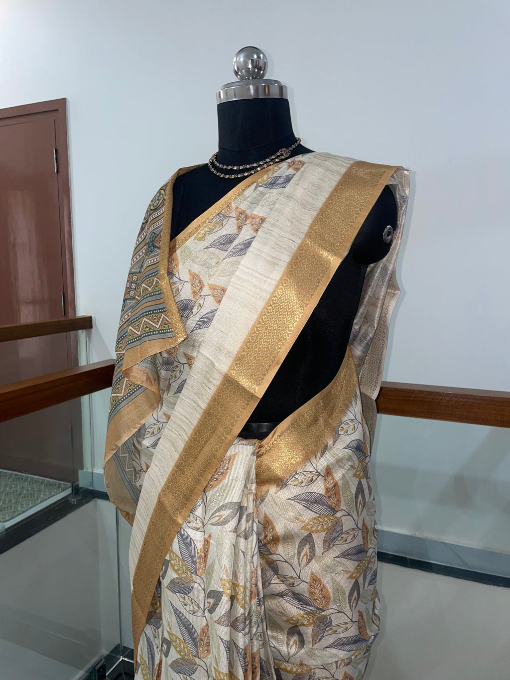 Beautiful Tissue Silk Saree with combination of Cream, Silver and Weaving Gold Zari Saree.