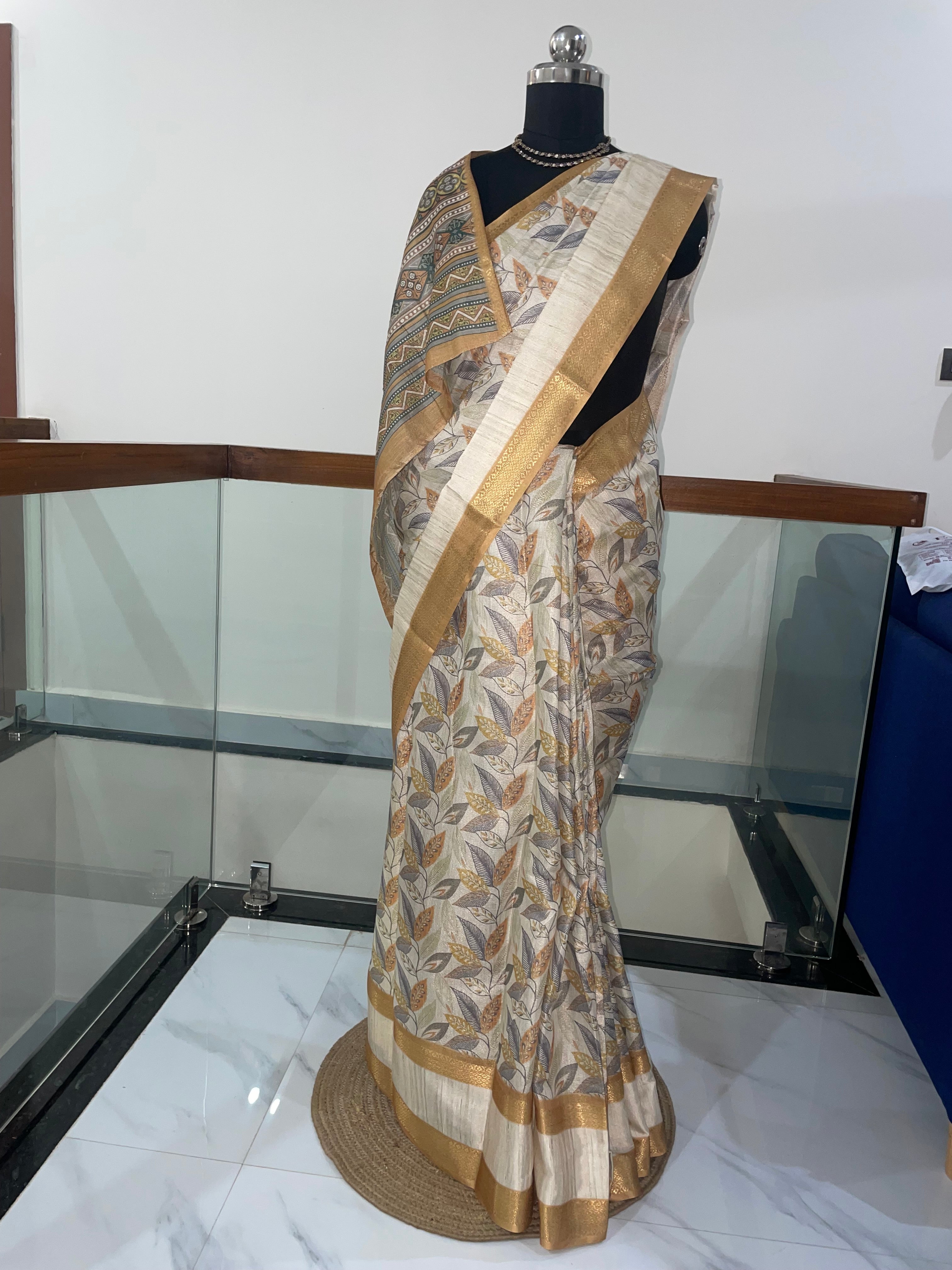 Beautiful Tissue Silk Saree with combination of Cream, Silver and Weaving Gold Zari Saree.