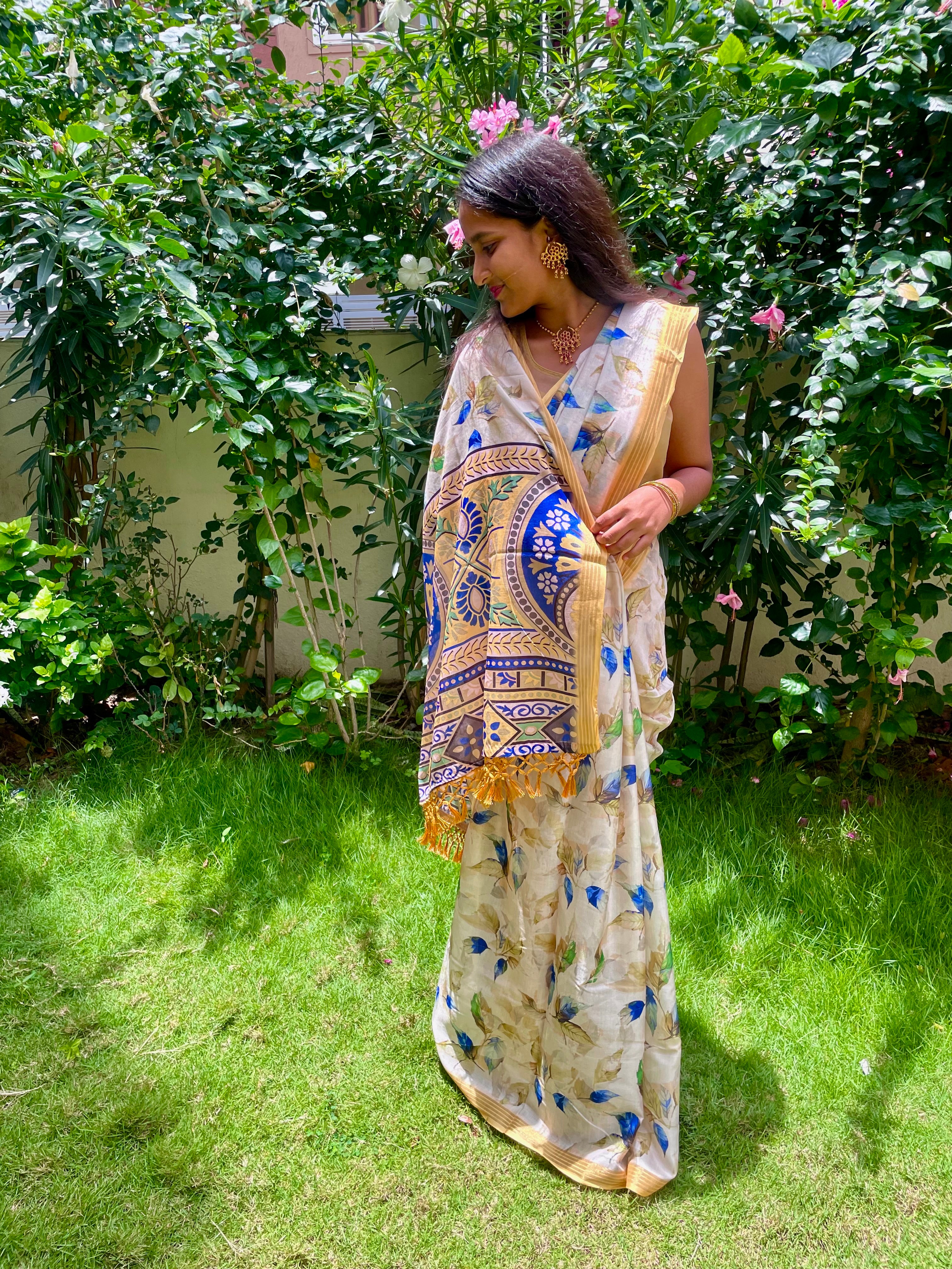 Elegant Beige Floral Cotton silk Soft Saree with Royal Blue Accents and Complemented by Golden Border With Tassel Detailing.