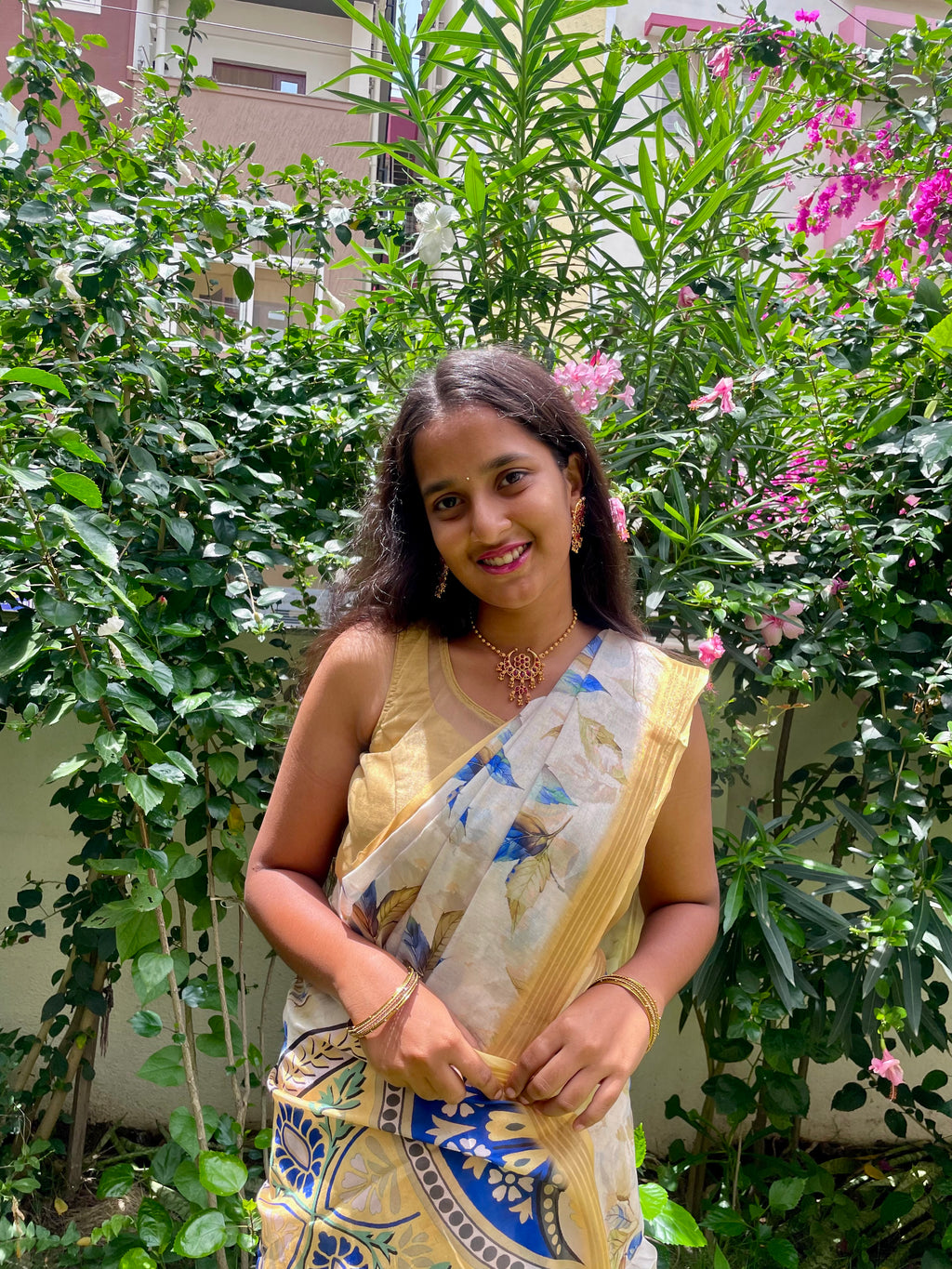 Elegant Beige Floral Cotton silk Soft Saree with Royal Blue Accents and Complemented by Golden Border With Tassel Detailing.