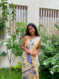 Elegant Beige Floral Cotton silk Soft Saree with Royal Blue Accents and Complemented by Golden Border With Tassel Detailing.