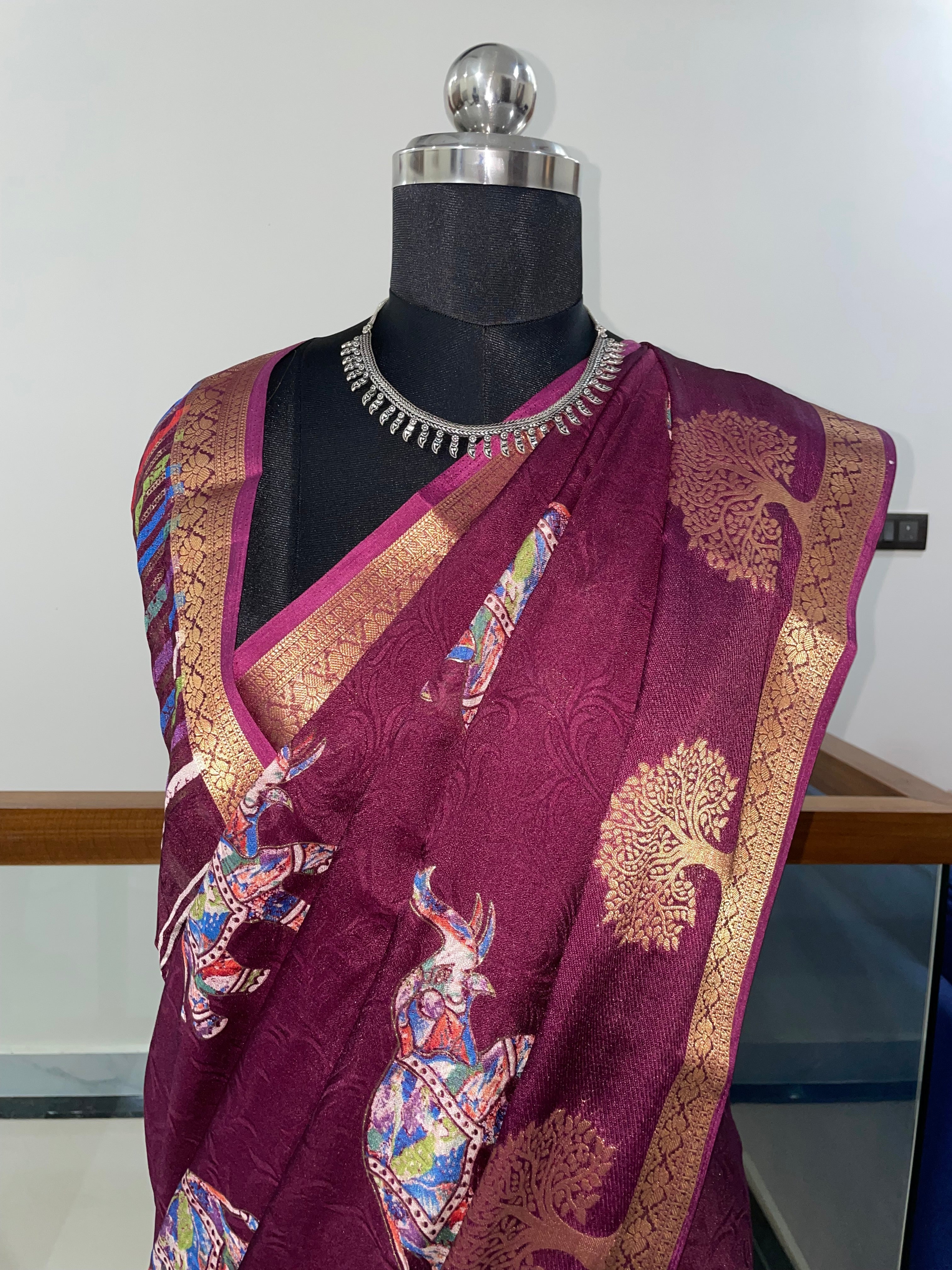 Beautiful Wine Purple Tussar Silk Saree with Golden Weaving Zari Border and Elephant Prints.