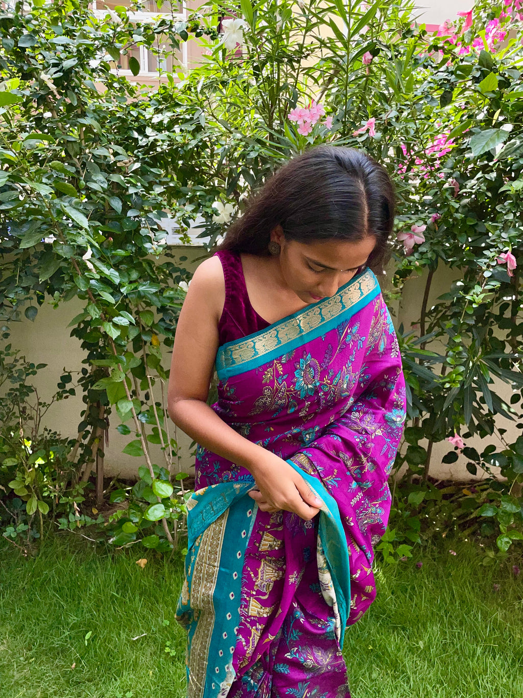 Elegant Rich Magenta Purple Satin Silk Mix Saree with Floral Motifs, Beautifully complemented by a Vibrant Turquoise Blue Border with Traditional Zari.