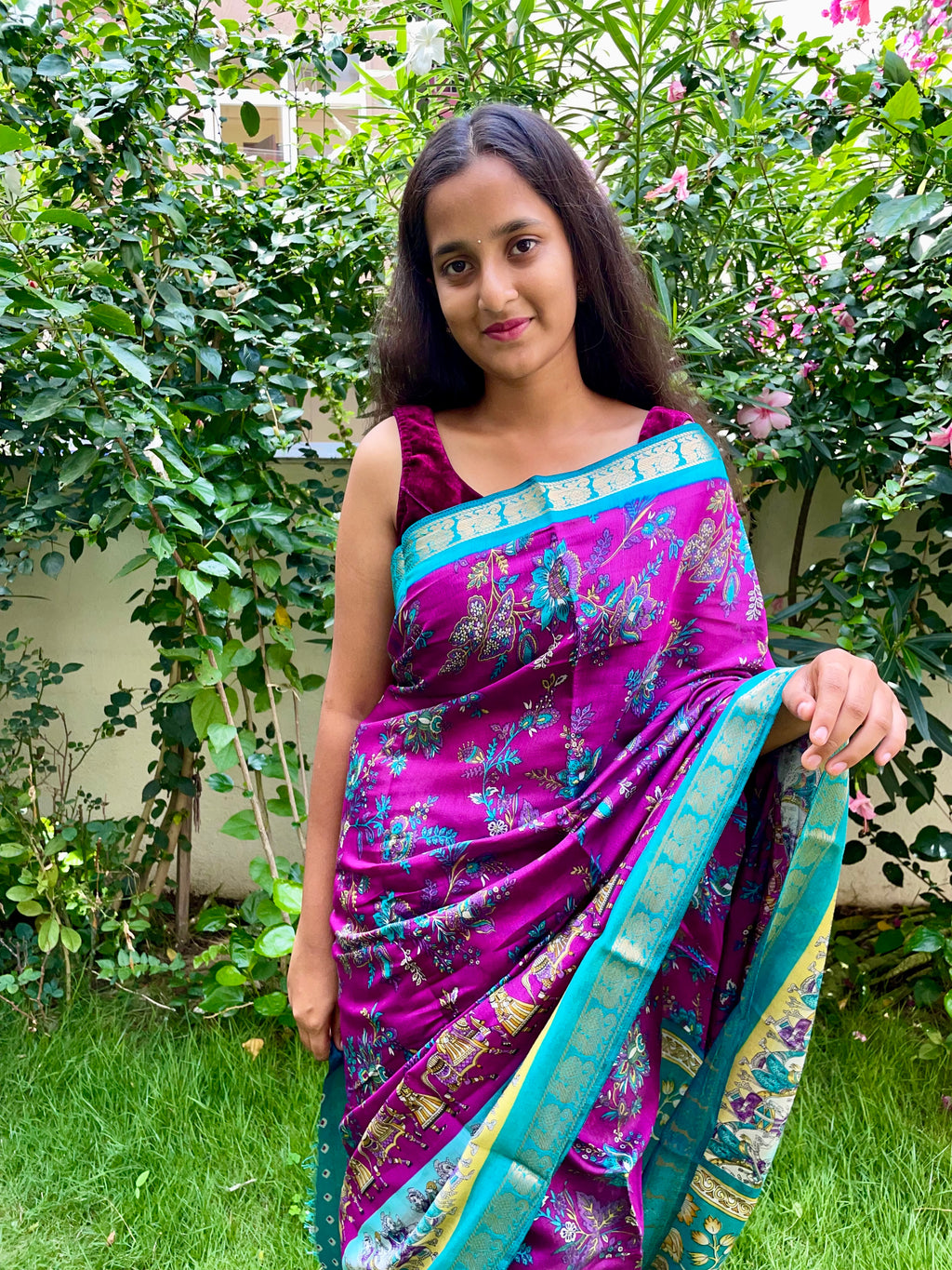 Elegant Rich Magenta Purple Satin Silk Mix Saree with Floral Motifs, Beautifully complemented by a Vibrant Turquoise Blue Border with Traditional Zari.