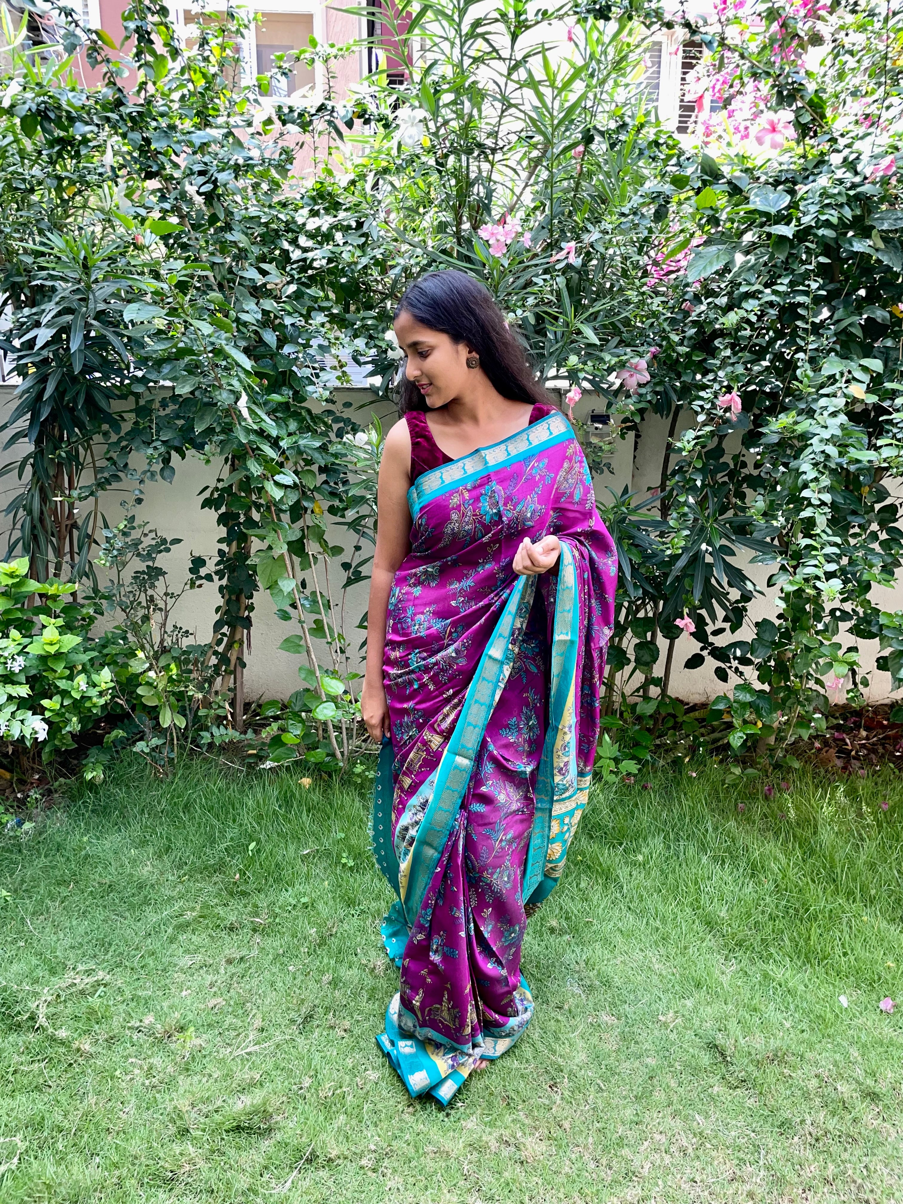 Elegant Rich Magenta Purple Satin Silk Mix Saree with Floral Motifs, Beautifully complemented by a Vibrant Turquoise Blue Border with Traditional Zari.