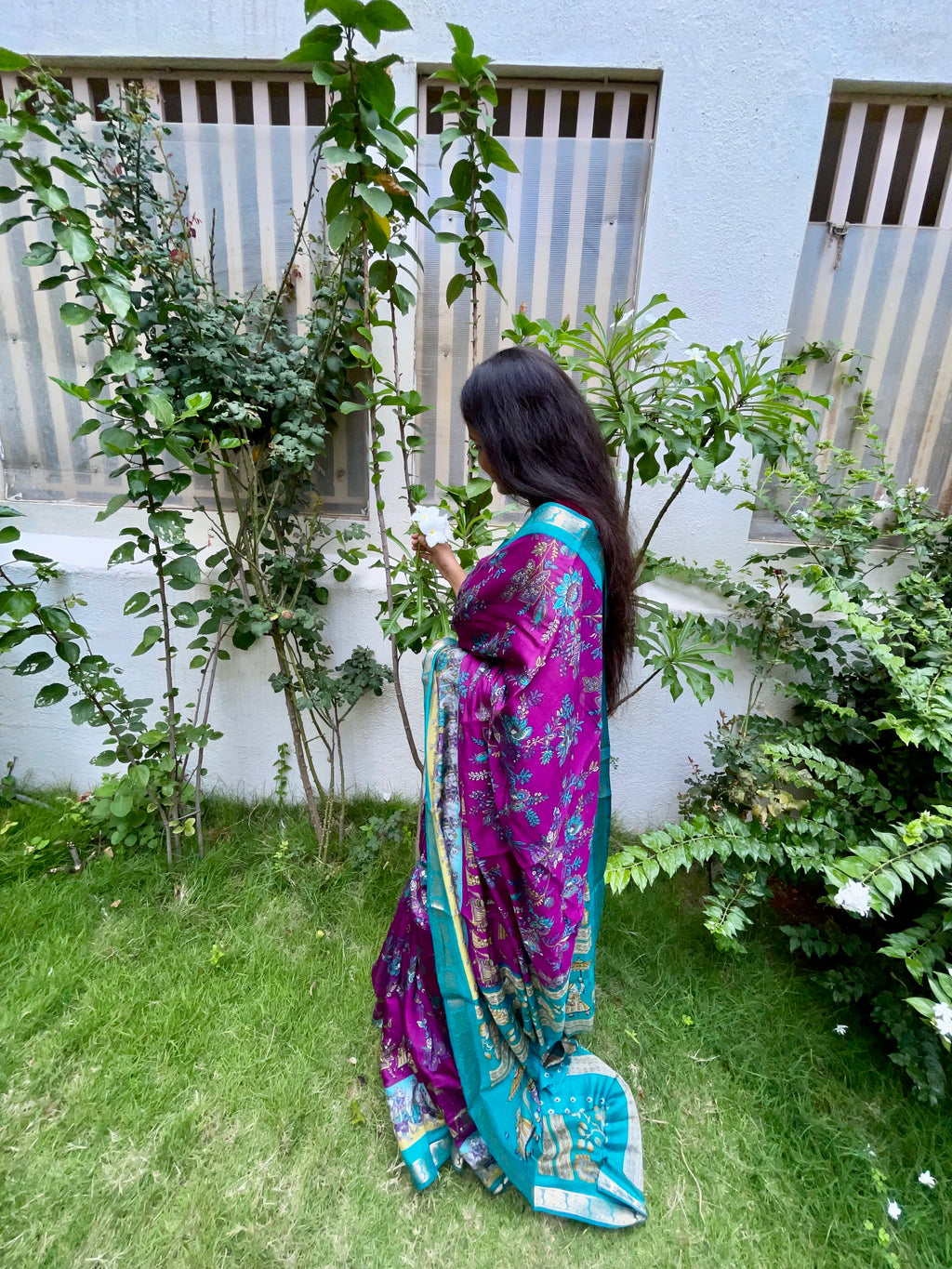 Elegant Rich Magenta Purple Satin Silk Mix Saree with Floral Motifs, Beautifully complemented by a Vibrant Turquoise Blue Border with Traditional Zari.