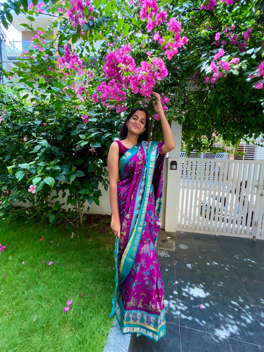 Elegant Rich Magenta Purple Satin Silk Mix Saree with Floral Motifs, Beautifully complemented by a Vibrant Turquoise Blue Border with Traditional Zari.