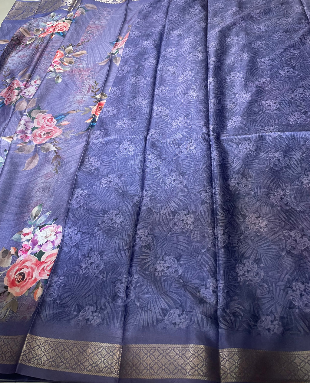 Elegant  lavender-purple saree featuring beautiful floral prints with rich woven zari border - Satin Tissue Saree