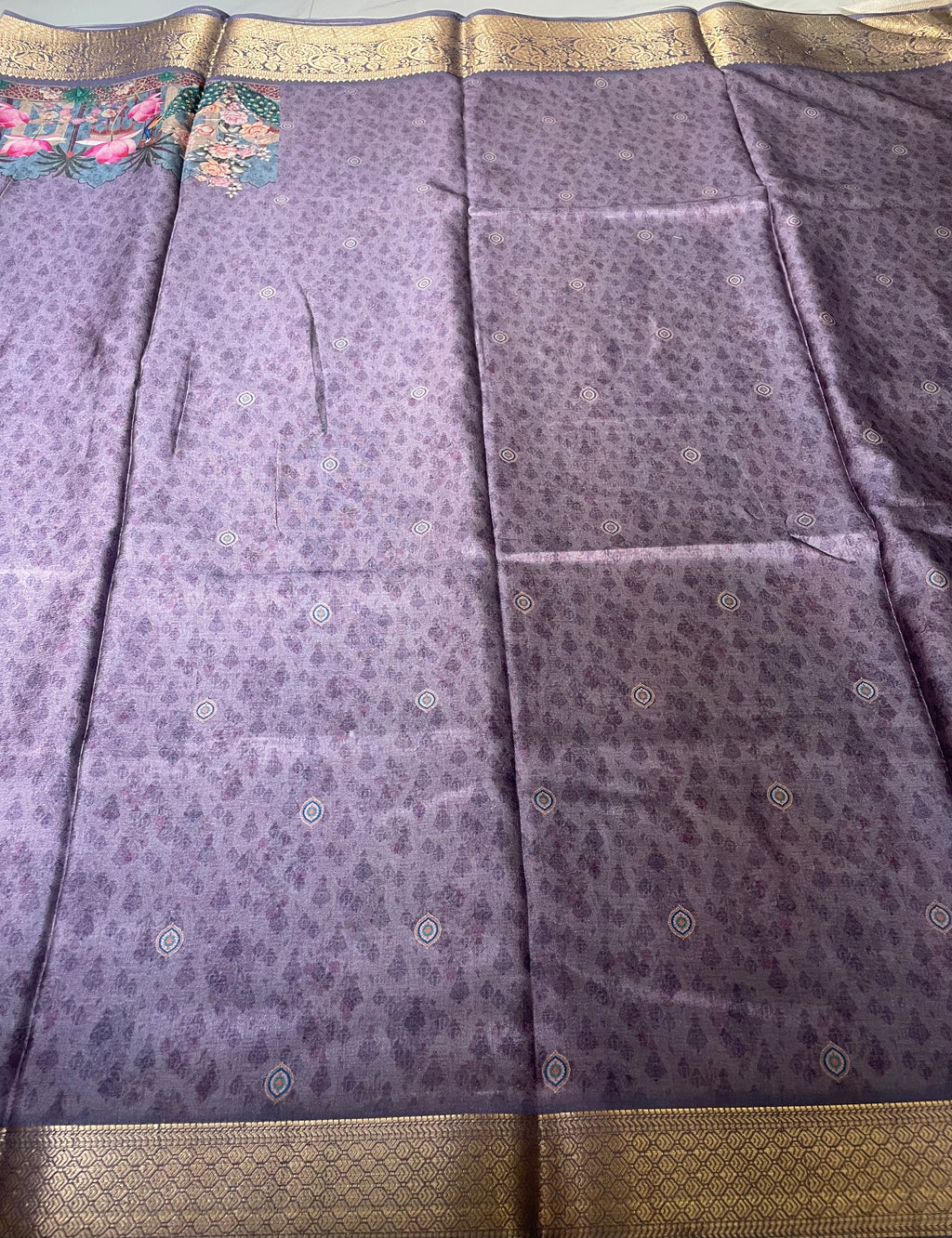 Elegant lavender-purple saree featuring a graceful peacock and floral garden print with rich zari border - Satin Tissue Saree (Copy)