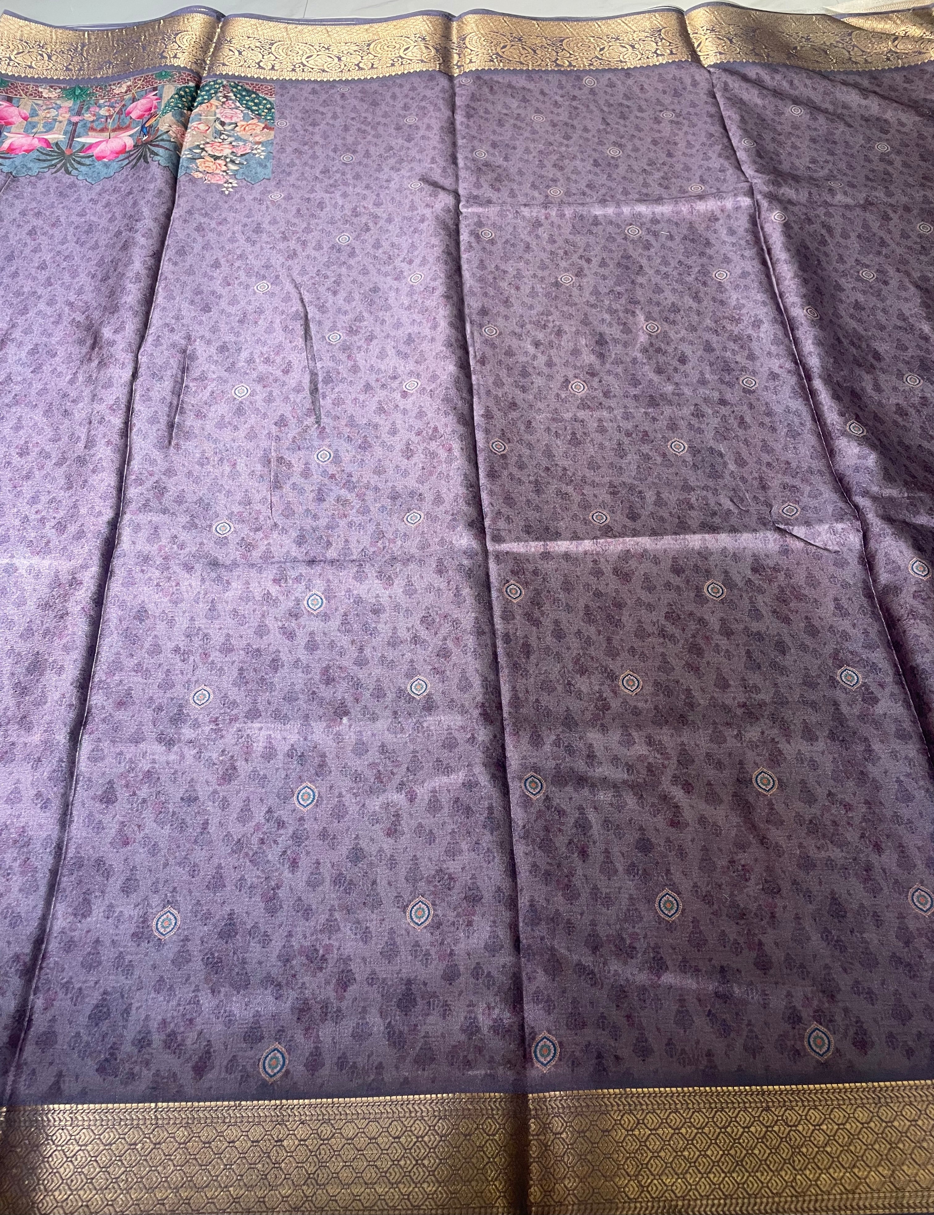 Elegant lavender-purple saree featuring a graceful peacock and floral garden print with rich zari border - Satin Tissue Saree (Copy)