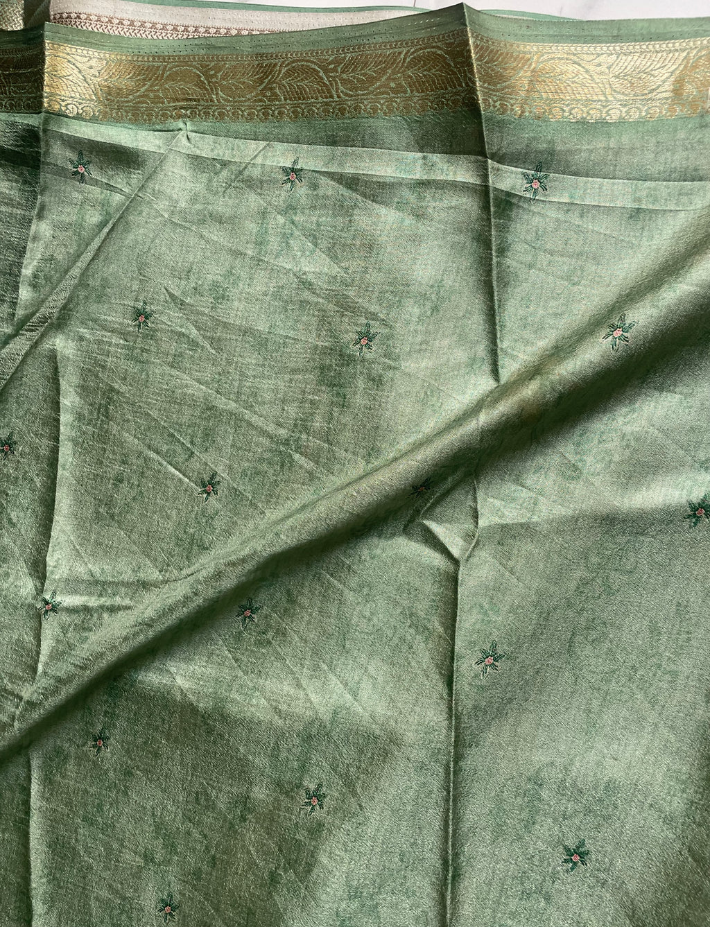 Elegant pastel green shade a beautiful  peacock and floral digital print with rich zari border - Satin Tissue Saree