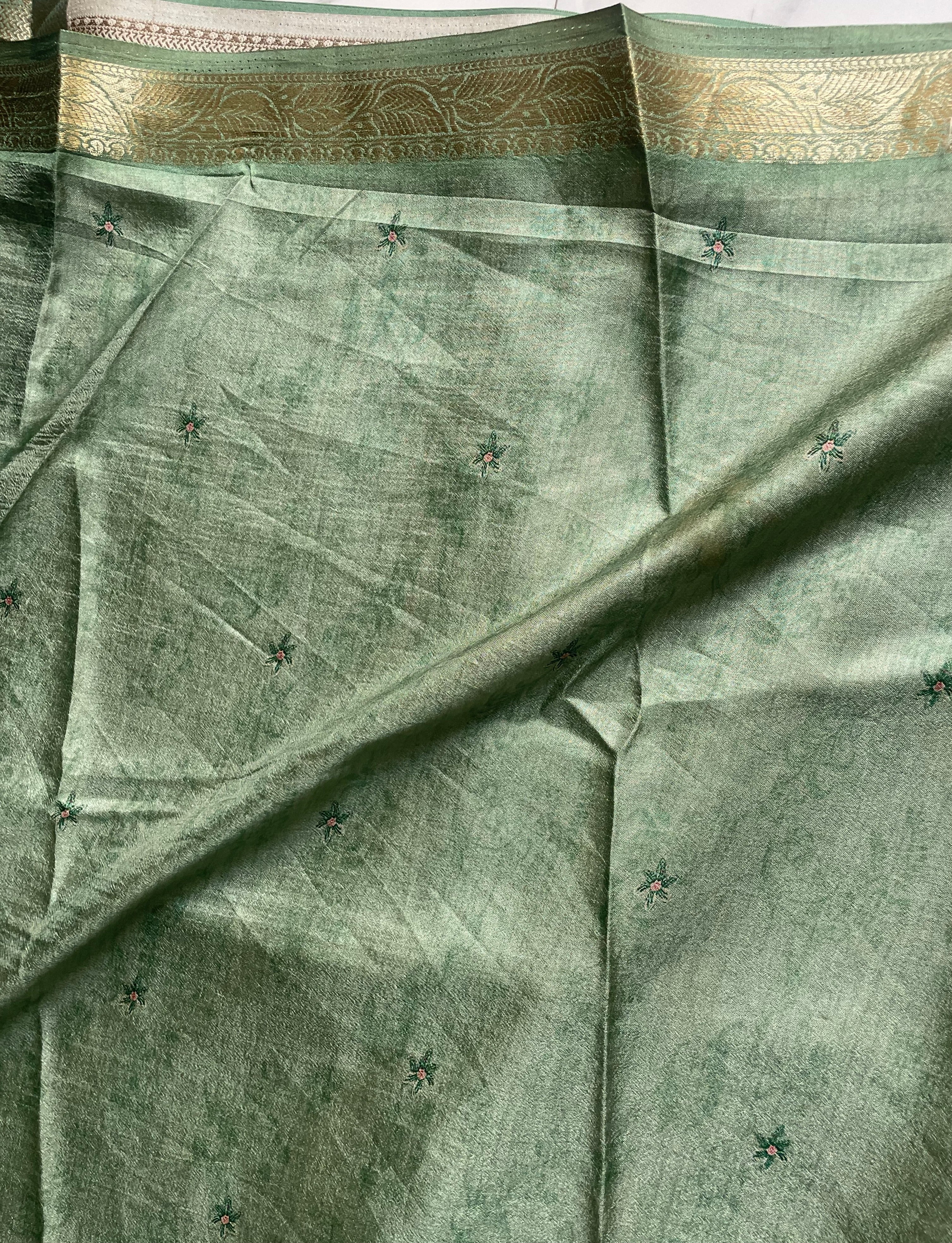 Elegant pastel green shade a beautiful  peacock and floral digital print with rich zari border - Satin Tissue Saree