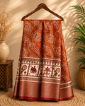Elegant rust brown saree featuring artistic white floral line prints with a ethnic border inspired by traditional motifs - Cotton tissue soft Saree