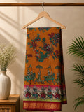 Elegant mustard brown saree, with vibrant floral prints and detailed heritage-inspired with a rich zari border