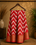 Stunning red saree featuring bold white zigzag patterns and golden border- Cotton tissue soft Saree
