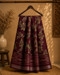 Elegant maroon saree featuring graceful floral vine prints in contrasting green tones and silver zari line border- Cotton silk soft Saree