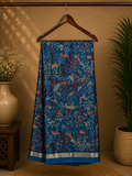 Elegant royal blue saree featuring an intricate all-over nature-inspired print and subtle Silver edging.