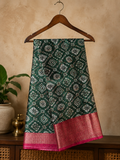 Beautiful Dark Green Saree Featuring Geometric and Floral Motifs with Rich Contrast Pink Weaving Zari Border