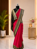 Beautiful Crepe Silk Saree with Striking Combination Of Bright Pink with a rich Navy Blue and gold border, giving it a Regal and Elegant look.